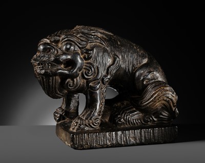 Lot 111 - A RARE AND IMPRESSIVE BLACK STONE FIGURE OF A LION, TANG DYNASTY