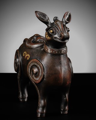Lot 102 - A GOLD AND SILVER-INLAID BRONZE TAPIR-FORM VESSEL, XIZUN, LATE MING-EARLY QING DYNASTY, 17TH-18TH CENTURY