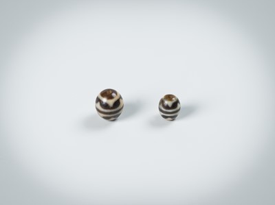 Lot 50 - TWO AGATE CHUNG DZI BEADS
