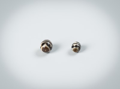 Lot 50 - TWO AGATE CHUNG DZI BEADS
