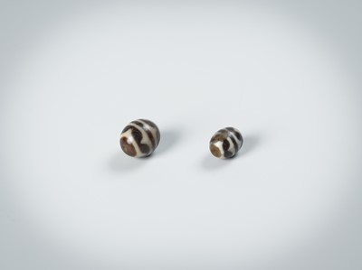 Lot 50 - TWO AGATE CHUNG DZI BEADS
