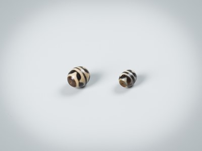 Lot 50 - TWO AGATE CHUNG DZI BEADS