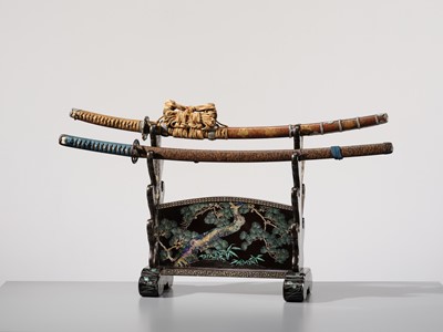 Lot 135 - A SUPERB MOTHER-OF-PEARL INLAID AND BLACK-LACQUERED ‘THREE FRIENDS OF WINTER (SHOCHIKUBAI)’ KATANA-KAKE (SWORD STAND)