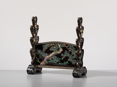 Lot 135 - A SUPERB MOTHER-OF-PEARL INLAID AND BLACK-LACQUERED ‘THREE FRIENDS OF WINTER (SHOCHIKUBAI)’ KATANA-KAKE (SWORD STAND)