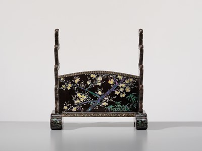 Lot 135 - A SUPERB MOTHER-OF-PEARL INLAID AND BLACK-LACQUERED ‘THREE FRIENDS OF WINTER (SHOCHIKUBAI)’ KATANA-KAKE (SWORD STAND)
