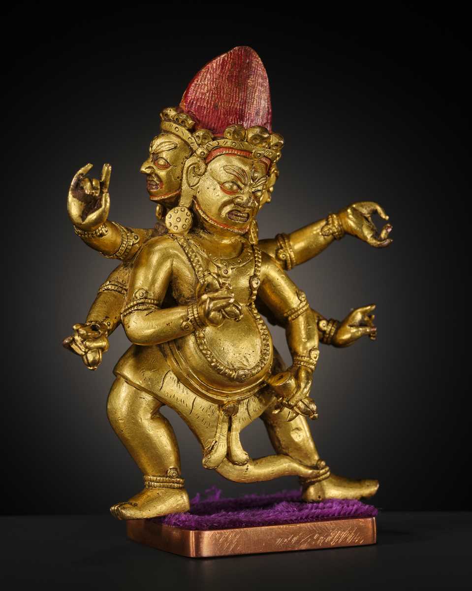 Lot 22 - A GILT-BRONZE FIGURE OF SHADBHUJA MAHAKALA, 18TH-19TH CENTURY