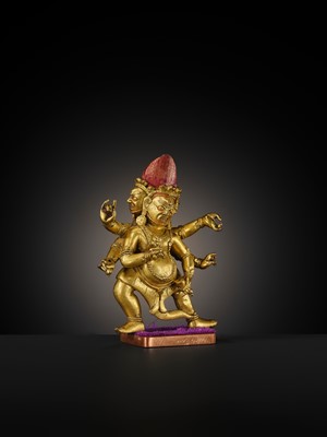 Lot 22 - A GILT-BRONZE FIGURE OF SHADBHUJA MAHAKALA, 18TH-19TH CENTURY
