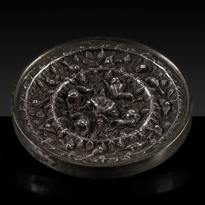 Lot 376 - A RARE ‘LION AND GRAPEVINE’ SILVER-INSET BRONZE MIRROR, TANG DYNASTY