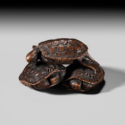 Lot 222 - TADATOSHI: A FINE SMALL WOOD NETSUKE OF FOUR TURTLES