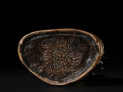 Lot 17 - AN INLAID GILT-BRONZE FIGURE OF AKSHOBHYA, TIBET, 16TH-17TH CENTURY