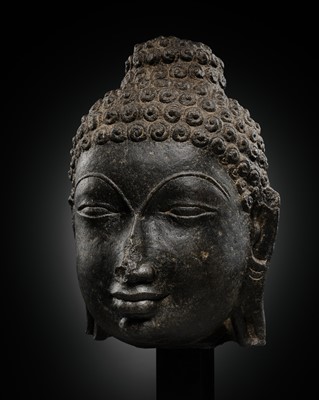Lot 212 - AN IMPORTANT AND EXTREMELY RARE BLACK BASALT STONE HEAD OF A JAIN TIRTHANKARA, SOLANKI DYNASTY, 11TH CENTURY