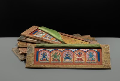 Lot 50 - A SET OF SIX FINELY PAINTED INNER COVER PANELS FROM THE 1794 QIANLONG KANGYUR IN MANCHU SCRIPT