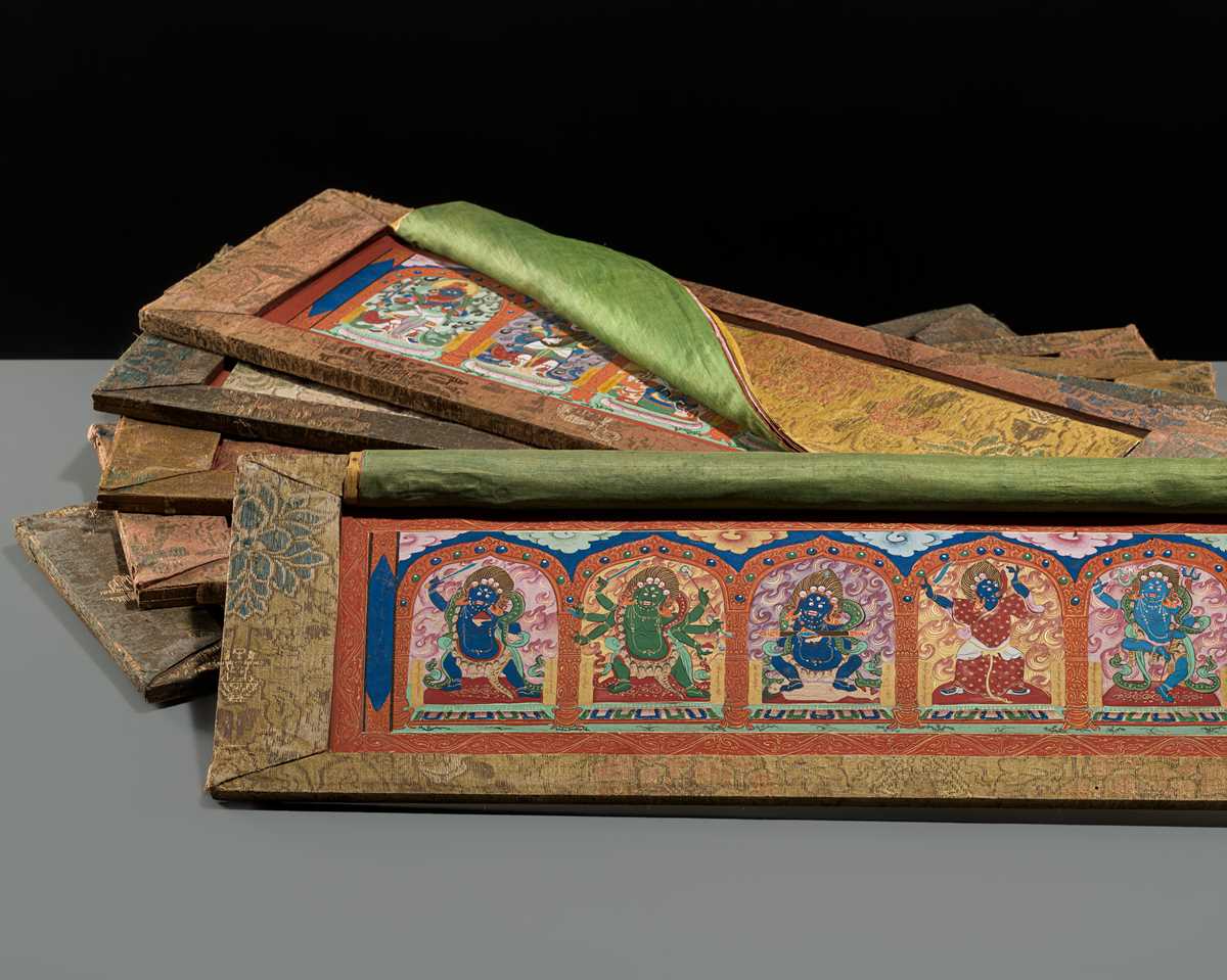 Lot 50 - A SET OF SIX FINELY PAINTED INNER COVER PANELS FROM THE 1794 QIANLONG KANGYUR IN MANCHU SCRIPT
