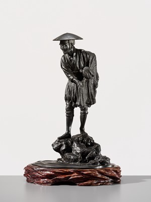 Lot 34 - YOSHITANI: A LARGE TOKYO SCHOOL BRONZE OKIMONO OF A FISHERMAN