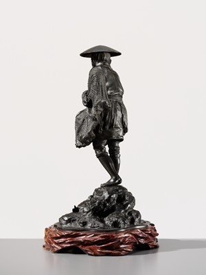 Lot 34 - YOSHITANI: A LARGE TOKYO SCHOOL BRONZE OKIMONO OF A FISHERMAN