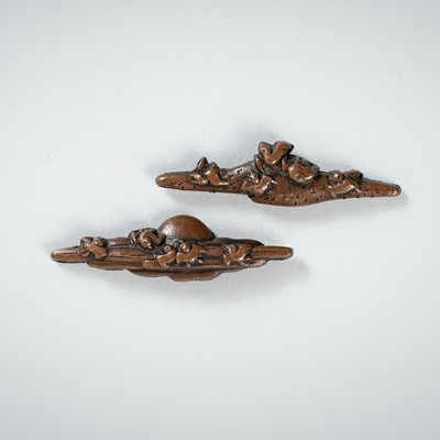 Lot 1964 - A PAIR OF DARK-PATINATED SUAKA MENUKI DEPICTING BIRDS