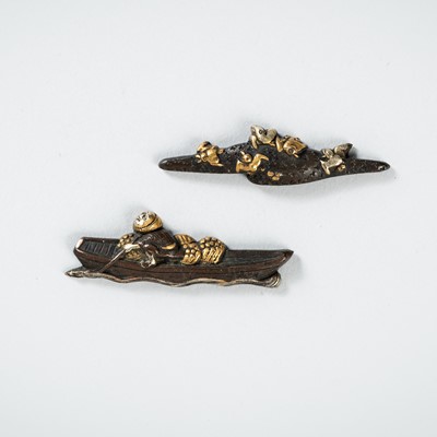 Lot 1965 - A PAIR OF SHIBUICHI MENUKI DEPICTING FISHERMAN AND BIRDS