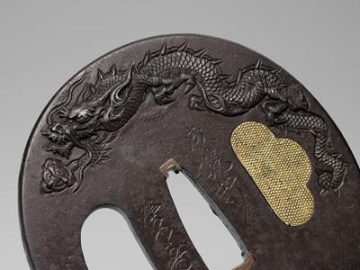 Lot 1829 - SEIRYUKEN EIJU: A LARGE IRON TSUBA WITH DRAGONS CHASING PEARLS