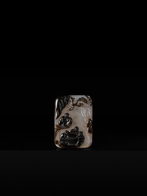 A GILT-INSCRIBED SUZHOU AGATE PENDANT, DATED 1804