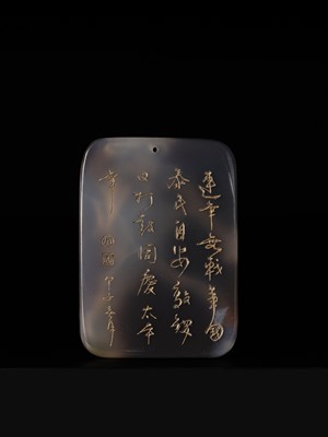 A GILT-INSCRIBED SUZHOU AGATE PENDANT, DATED 1804
