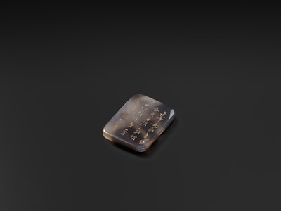 A GILT-INSCRIBED SUZHOU AGATE PENDANT, DATED 1804