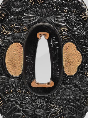 Lot 66 - TOMOMITSU: A FINE SHAKUDO TSUBA WITH KIKU (CHRYSANTHEMUMS)