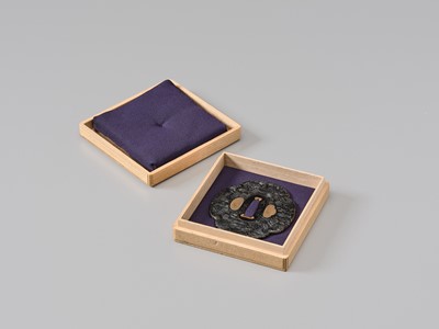 Lot 66 - TOMOMITSU: A FINE SHAKUDO TSUBA WITH KIKU (CHRYSANTHEMUMS)