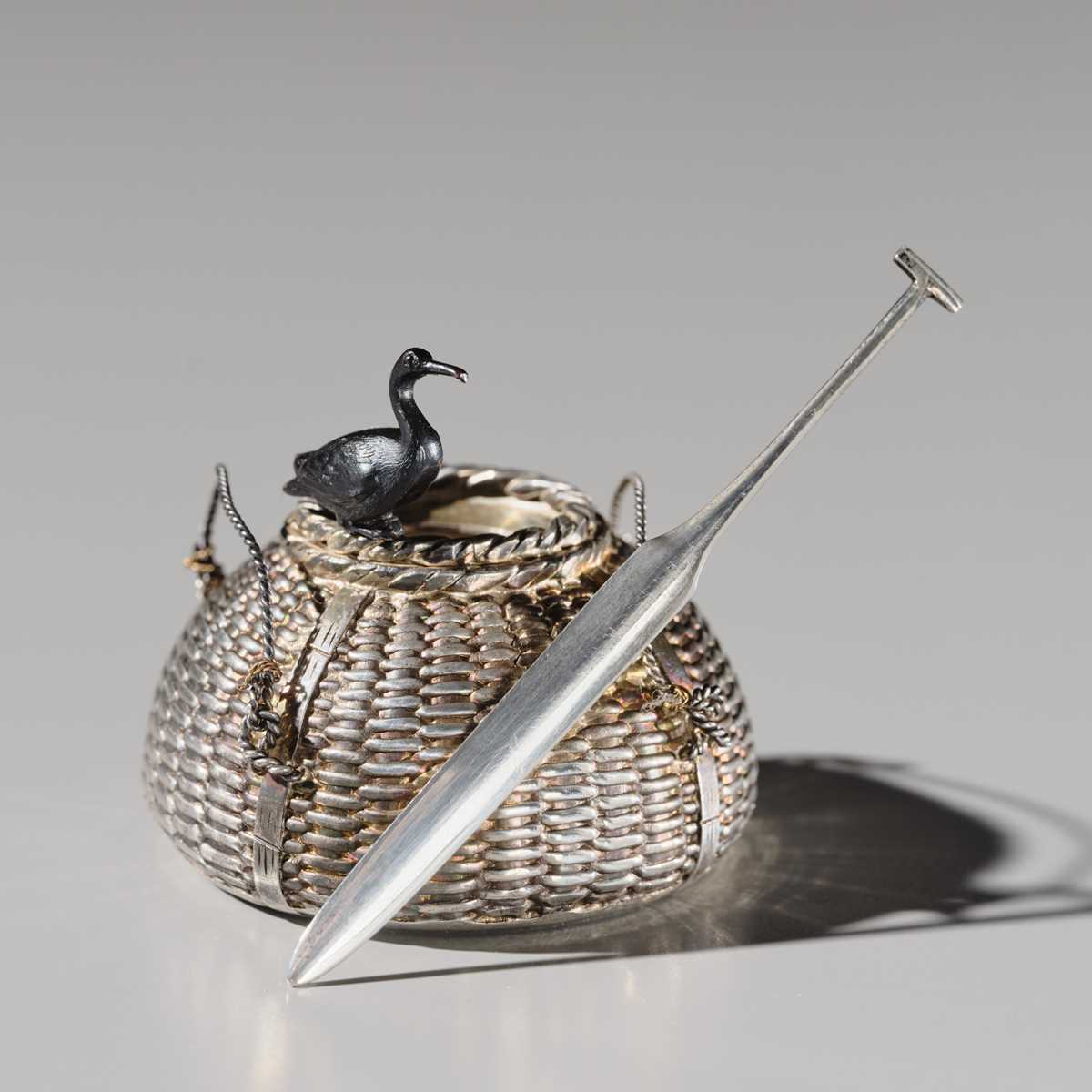 Lot 19 - HATTORI: A FINE SILVER AND SHAKUDO ‘CORMORANT FISHING’ YOJITATE (TOOTHPICK HOLDER)