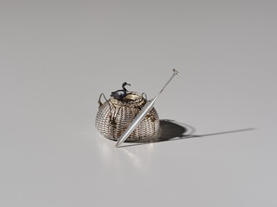 Lot 19 - HATTORI: A FINE SILVER AND SHAKUDO ‘CORMORANT FISHING’ YOJITATE (TOOTHPICK HOLDER)