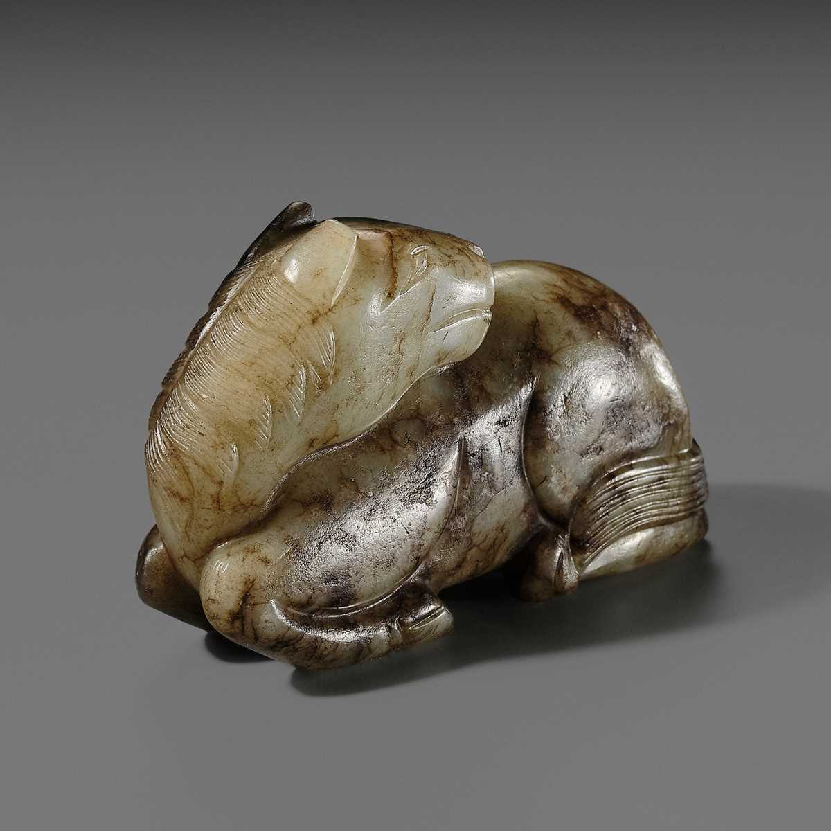 A CELADON AND BROWN JADE FIGURE OF A HORSE, MING DYNASTY