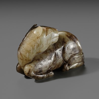 A CELADON AND BROWN JADE FIGURE OF A HORSE, MING DYNASTY
