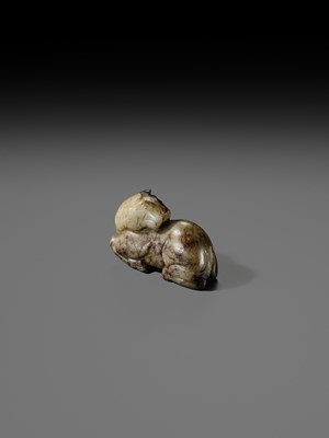 A CELADON AND BROWN JADE FIGURE OF A HORSE, MING DYNASTY