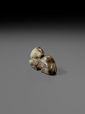 A CELADON AND BROWN JADE FIGURE OF A HORSE, MING DYNASTY