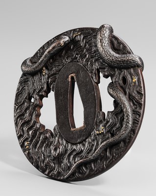 Lot 55 - IWAMOTO RYOKAN: A FINE IWAMOTO SCHOOL IRON TSUBA OF A SNAKE ON A TRUNK