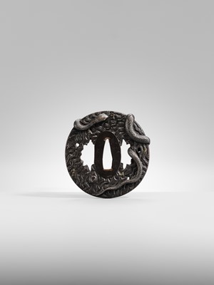 Lot 55 - IWAMOTO RYOKAN: A FINE IWAMOTO SCHOOL IRON TSUBA OF A SNAKE ON A TRUNK