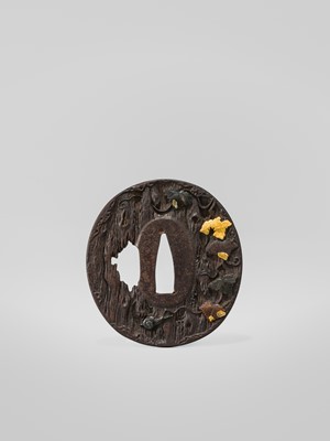 AN IRON HAMANO SCHOOL TSUBA DEPICTING A SNAIL ON AN OLD TREE, WITH HOZON TOSOGU NBTHK CERTIFICATE