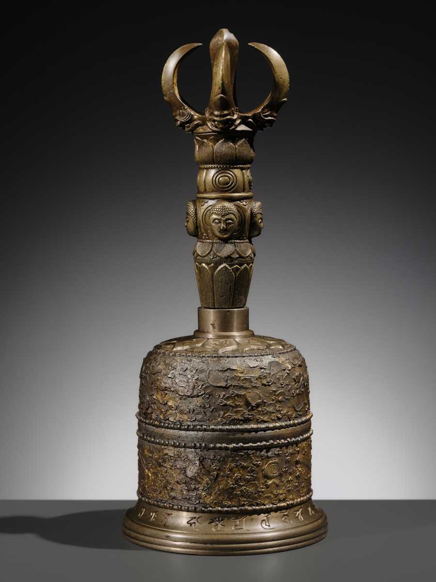 AN UNUSUAL AND LARGE PARCEL-GILT BRONZE FOUR-PRONGED VAJRA BELL