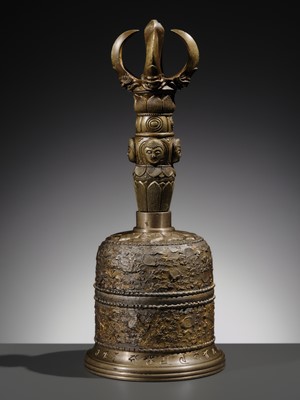 AN UNUSUAL AND LARGE PARCEL-GILT BRONZE FOUR-PRONGED VAJRA BELL