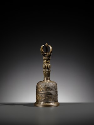 AN UNUSUAL AND LARGE PARCEL-GILT BRONZE FOUR-PRONGED VAJRA BELL