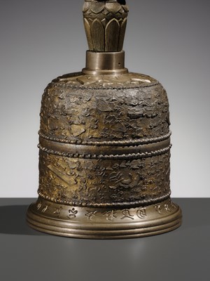 AN UNUSUAL AND LARGE PARCEL-GILT BRONZE FOUR-PRONGED VAJRA BELL