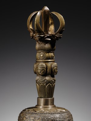 AN UNUSUAL AND LARGE PARCEL-GILT BRONZE FOUR-PRONGED VAJRA BELL