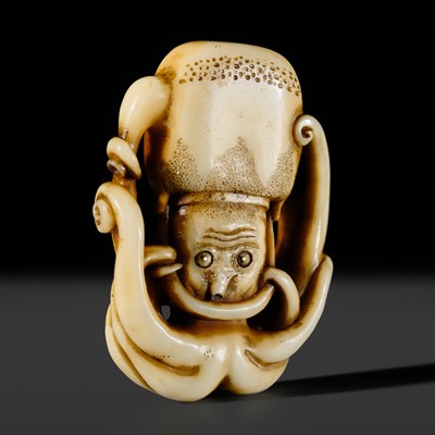Lot 338 - A RARE WALRUS TUSK NETSUKE OF AN OCTOPUS WITH A TEA POT