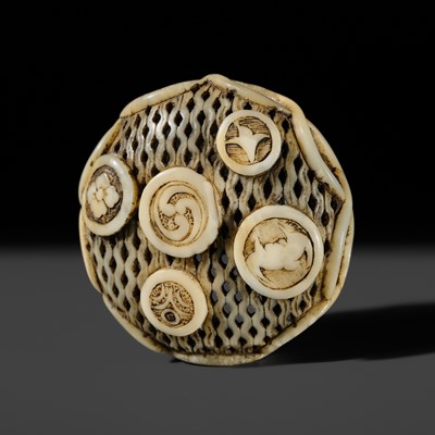 Lot 335 - KOKU: A FINE MARINE TUSK RYUSA MANJU NETSUKE WITH FIVE MEDAILLIONS