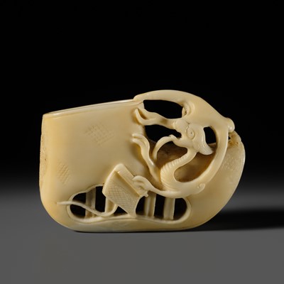 Lot 339 - A SUPERB WALRUS TUSK NETSUKE OF AN OLD SHOE WITH A WATER DRAGON, ATTRIBUTED TO KOKUSAI