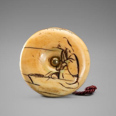 A WALRUS TUSK MANJU NETSUKE WITH A SEATED FIGURE