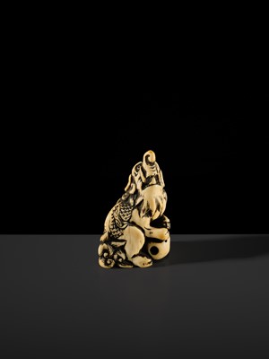 Lot 100 - A POWERFUL AND LARGE IVORY NETSUKE OF A BAKU