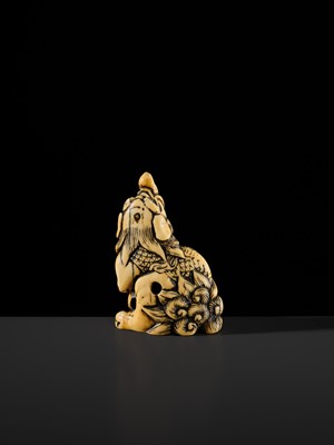 Lot 100 - A POWERFUL AND LARGE IVORY NETSUKE OF A BAKU
