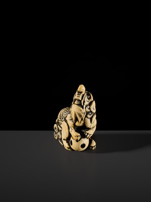 Lot 100 - A POWERFUL AND LARGE IVORY NETSUKE OF A BAKU