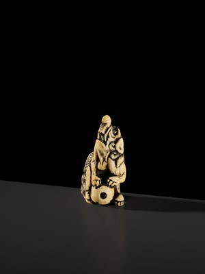 Lot 100 - A POWERFUL AND LARGE IVORY NETSUKE OF A BAKU
