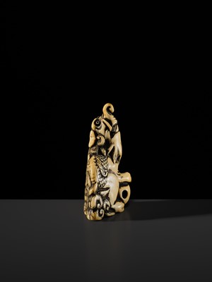 Lot 100 - A POWERFUL AND LARGE IVORY NETSUKE OF A BAKU